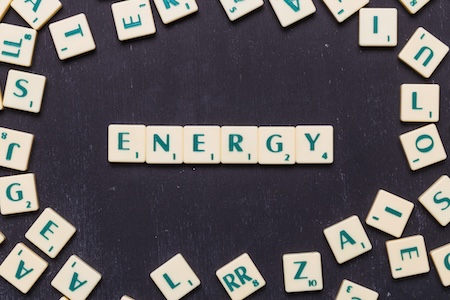 An energy-related word spelled out with Scrabble tiles.